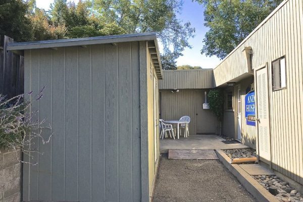 Our rear entrance features an outdoor seating area and a food shed where we stock prescription diets.